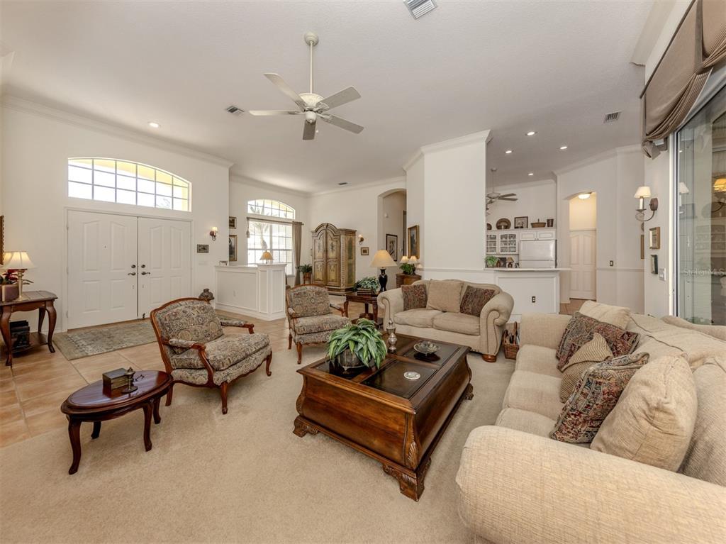 764 Sawgrass Bridge Road Venice, FL 34292 - Photo 6 of 60 a living room with furniture wooden floor and a window