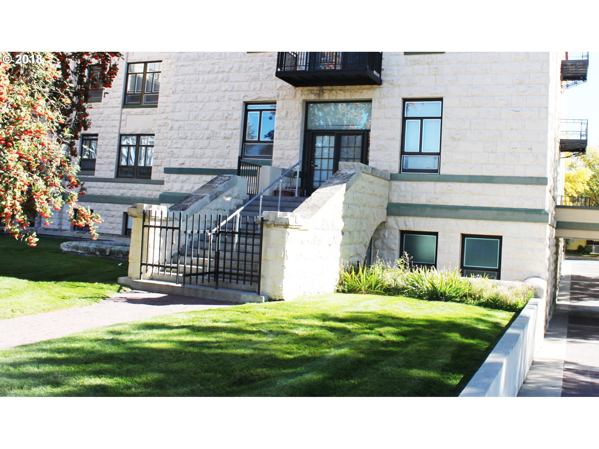 a view of house with a yard