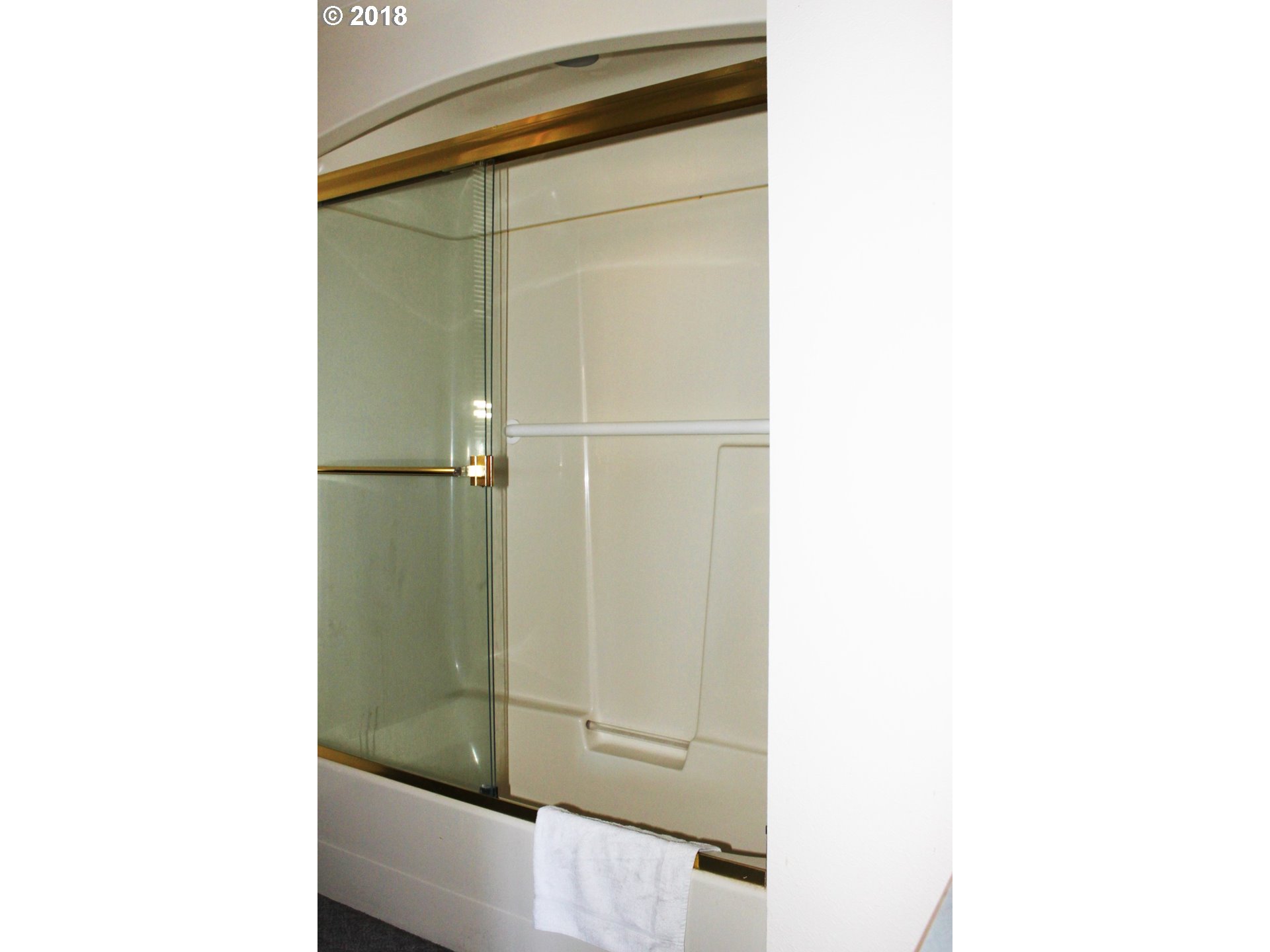 2365 4th Street Baker City, OR 97814 - Photo 14 of 16 a bathroom with a shower and a mirror