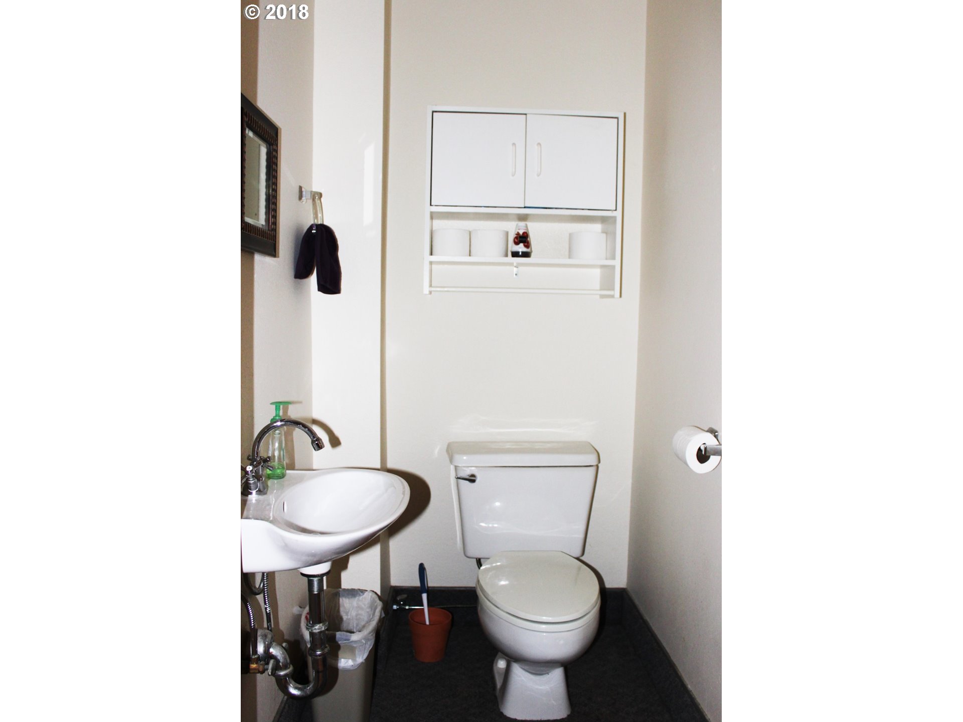 2365 4th Street Baker City, OR 97814 - Photo 16 of 16 a bathroom with a sink toilet and a mirror
