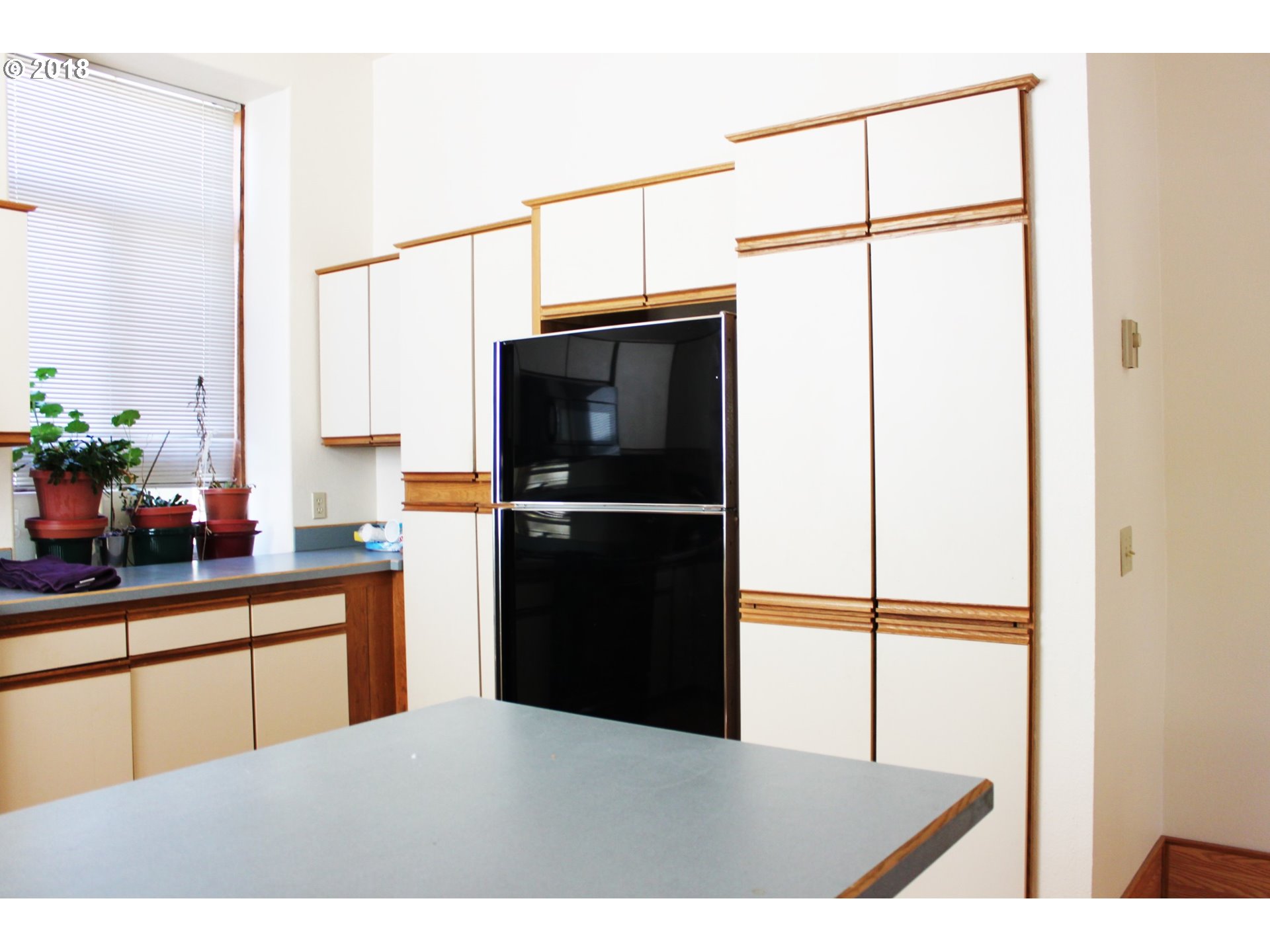2365 4th Street Baker City, OR 97814 - Photo 5 of 16 a kitchen with stainless steel appliances granite countertop a refrigerator and a sink