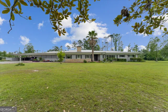 a view of a house with a big yard