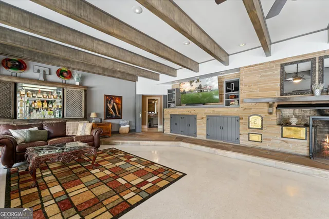 a dining room with furniture a chandelier and window