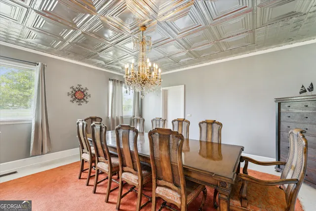 a kitchen with a sink a counter top space and a garden view