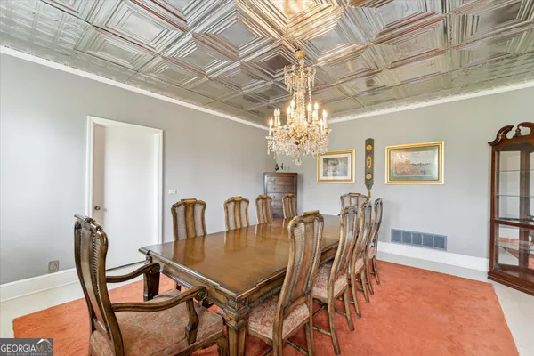 a bed room with a bed and a lamp