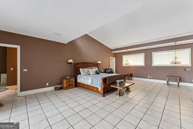 a spacious bathroom with a granite countertop sink mirror and a bathtub