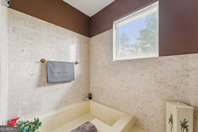 a bedroom with a bed and a view of bedroom