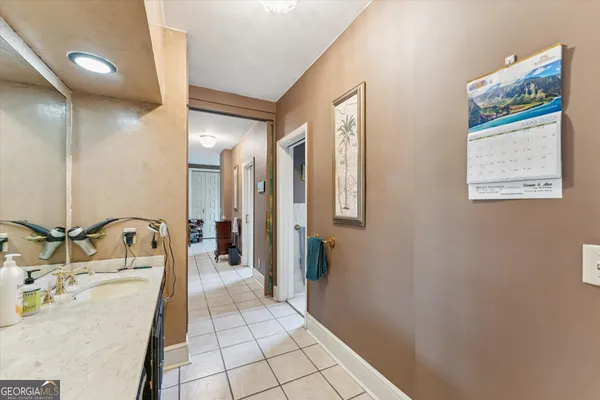 a bathroom with a toilet a sink and curtain