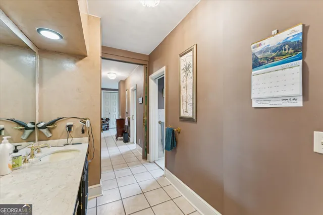 a bathroom with a toilet a sink and curtain