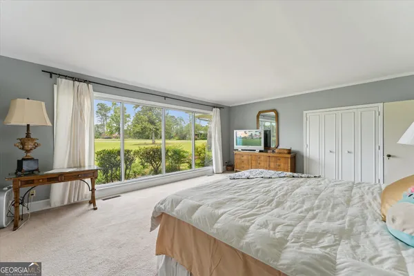 a bedroom with two beds and a couch