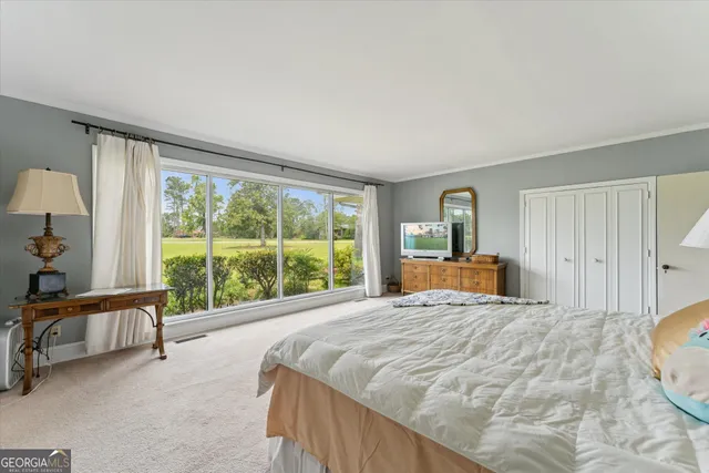 a bedroom with two beds and a couch