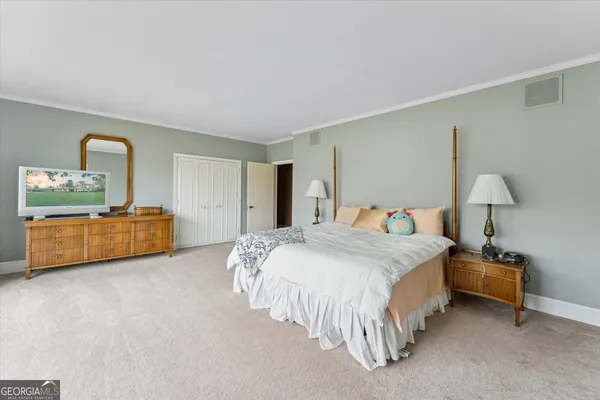 a bathroom with a sink mirror and toilet