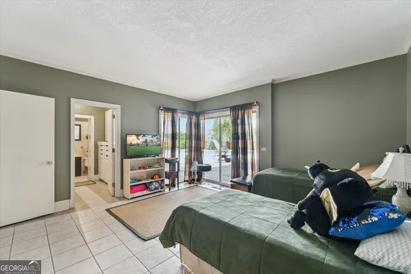 an aerial view of a house with a yard swimming pool and outdoor seating