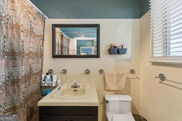 an aerial view of a house with outdoor space