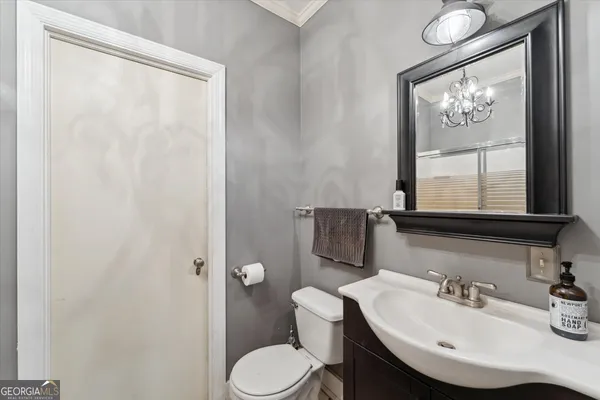 a view of a pool with a table and chairs