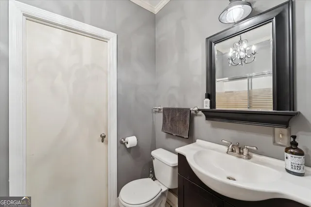 a view of a pool with a table and chairs