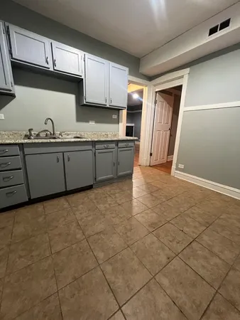 a kitchen with stainless steel appliances a sink a stove a microwave and cabinets