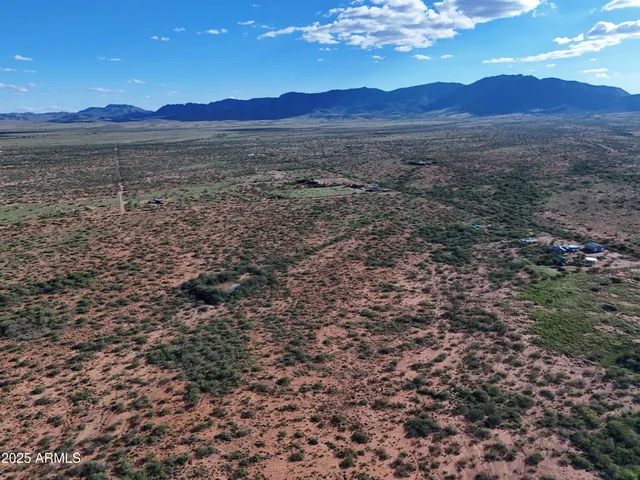 a view of an outdoor space and a mountain