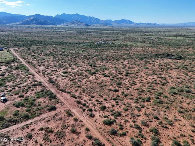 a view of an outdoor space and basketball court