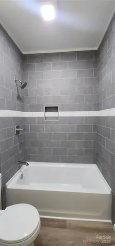 wooden floor in a room with a window