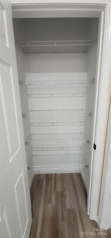 a view of a room with racks on the wall