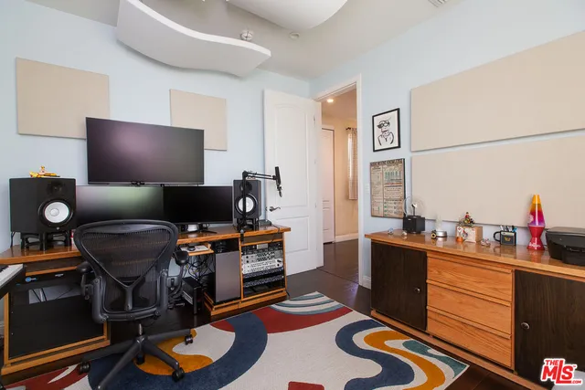 a work room with furniture and musical instruments