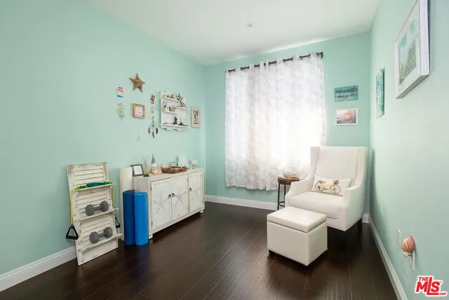 a spacious bedroom with a bed and a couch