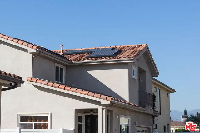 a view of a building with a roof deck