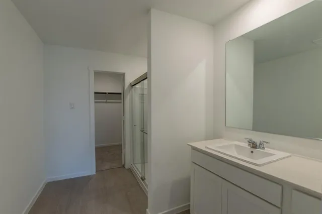 a bathroom with a sink and mirror