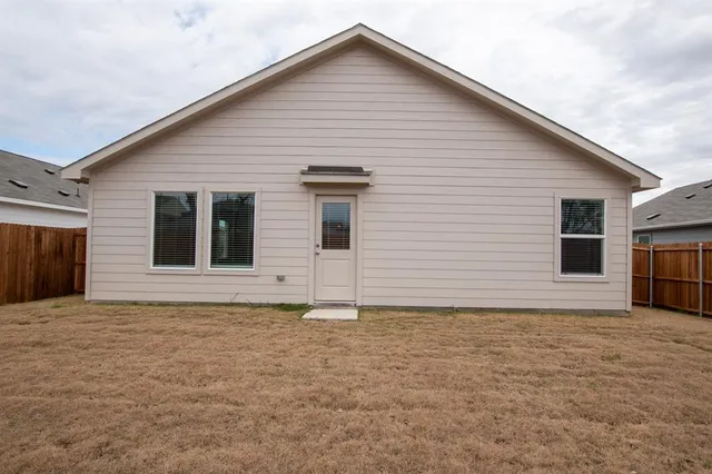 a view of an outdoor space and wooden fence