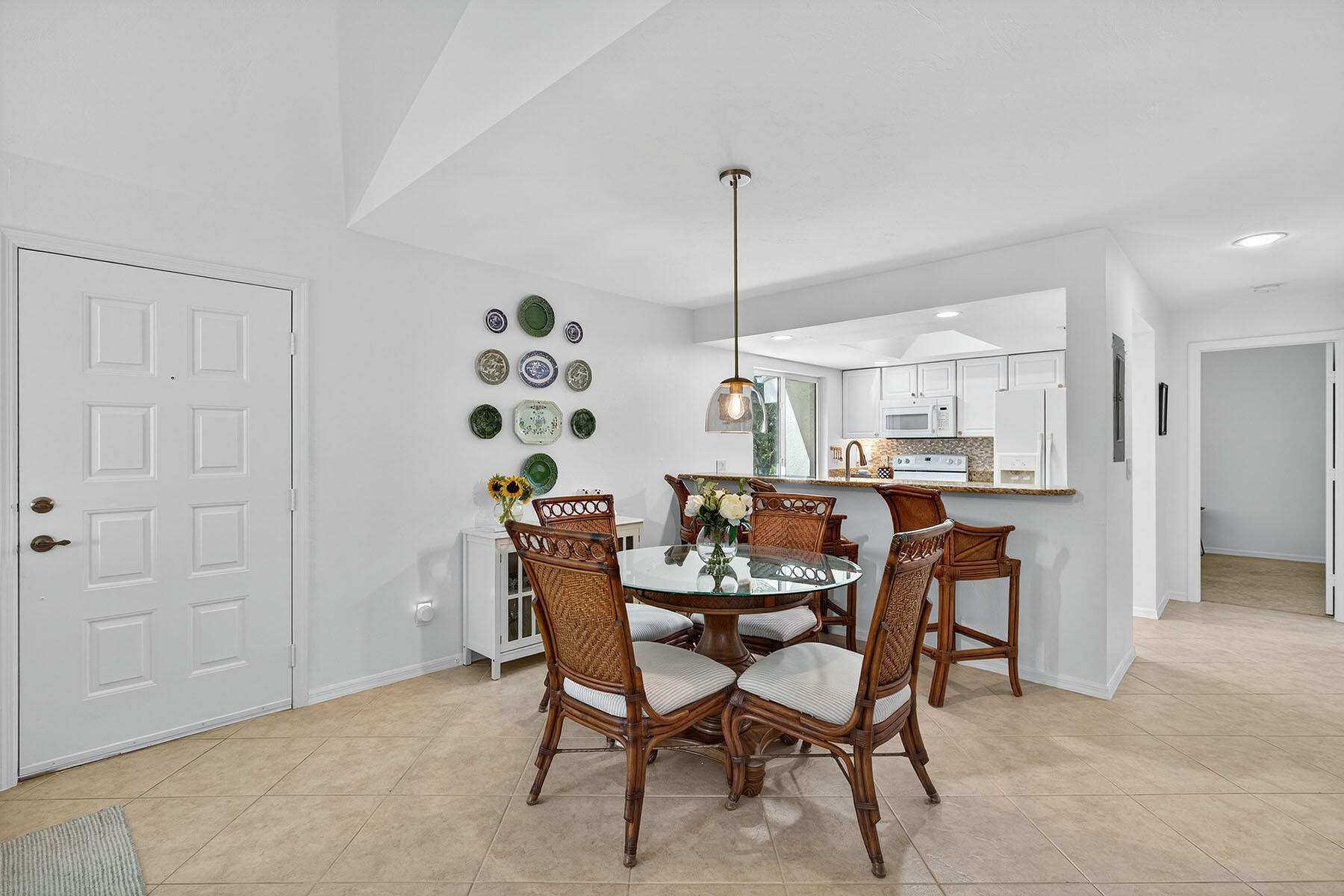 3136 Kings Lake Boulevard, Unit 7546 Naples, FL 34112 - Photo 11 of 32 a dining room with furniture and window