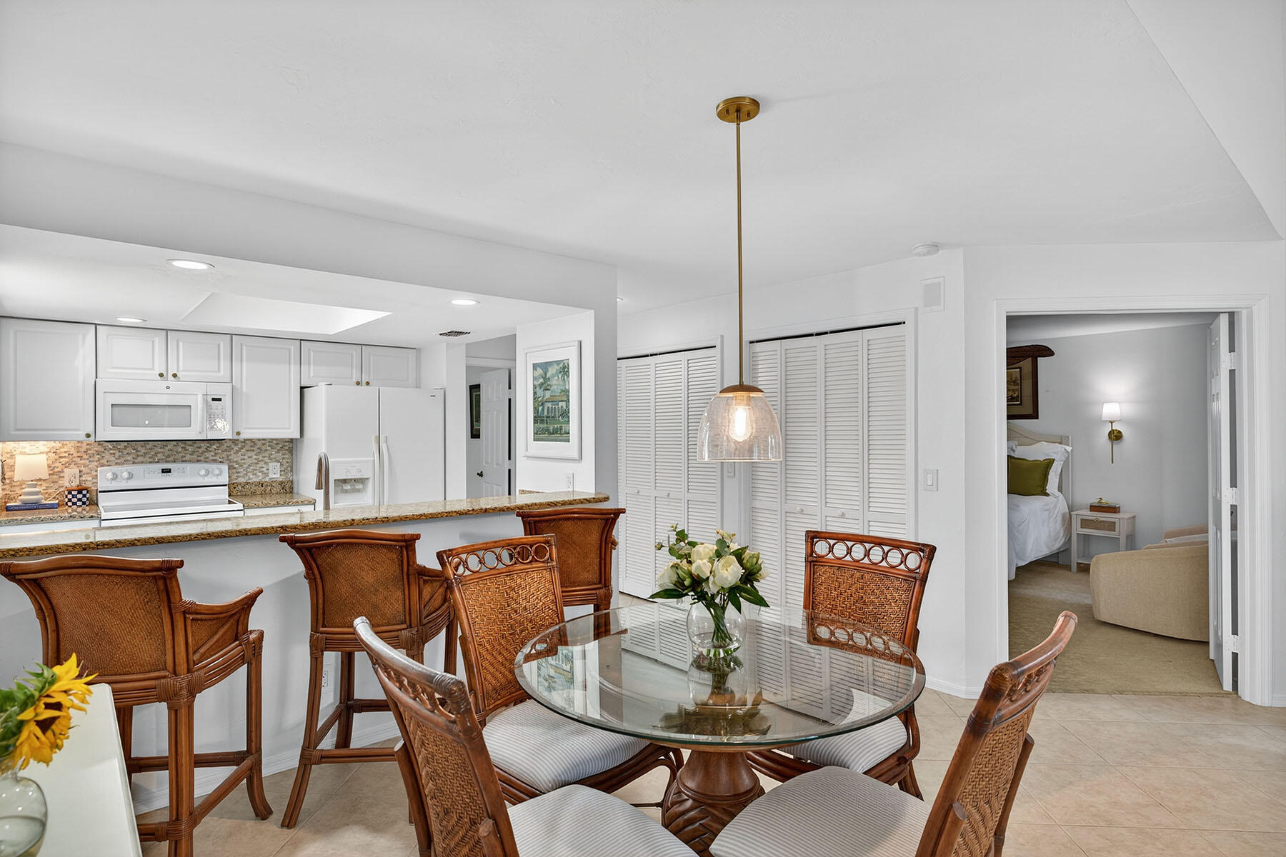 3136 Kings Lake Boulevard, Unit 7546 Naples, FL 34112 - Photo 12 of 32 a view of a dining room and livingroom