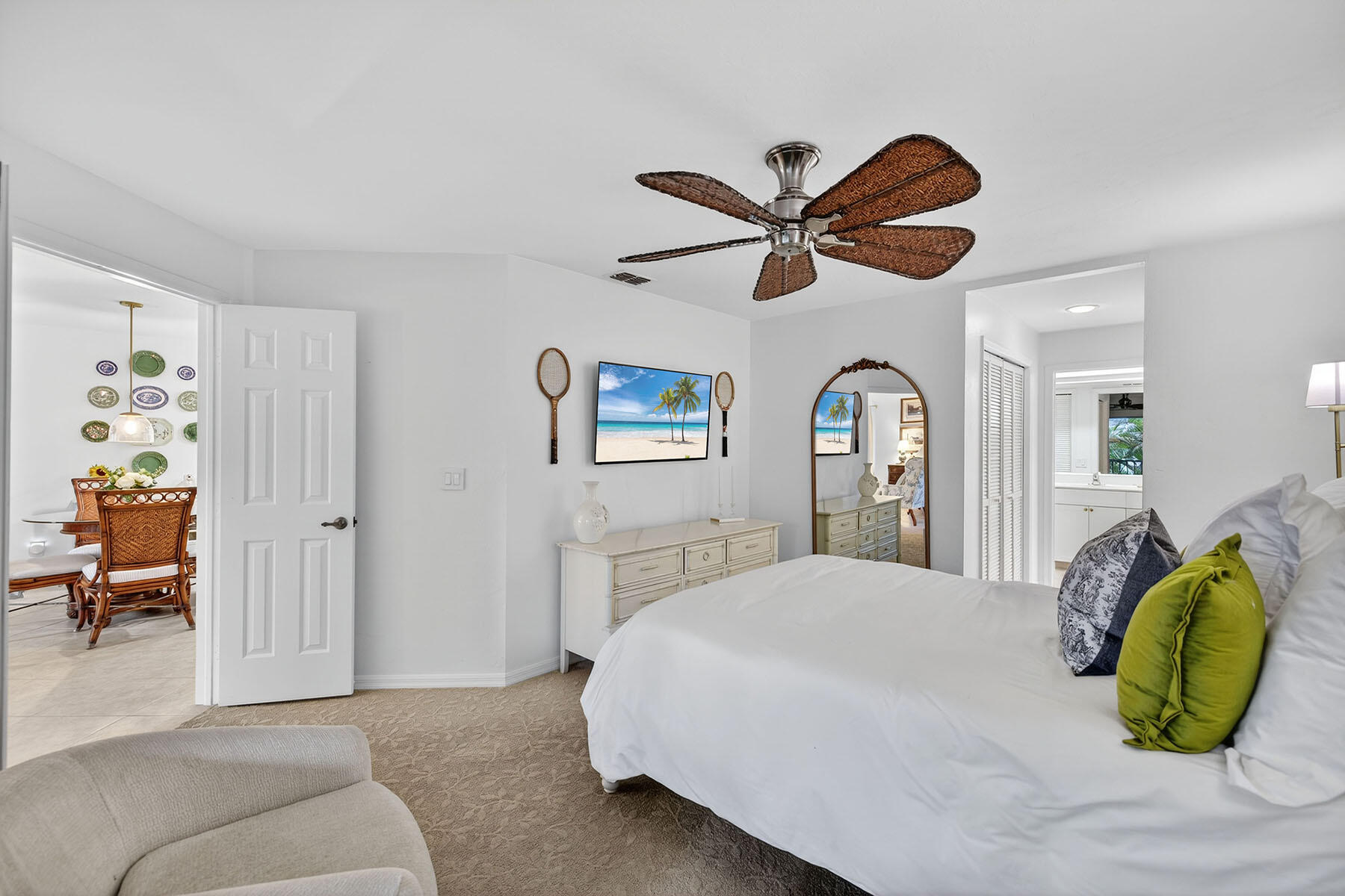 3136 Kings Lake Boulevard, Unit 7546 Naples, FL 34112 - Photo 15 of 32 a bedroom with a bed ceiling fan and a window