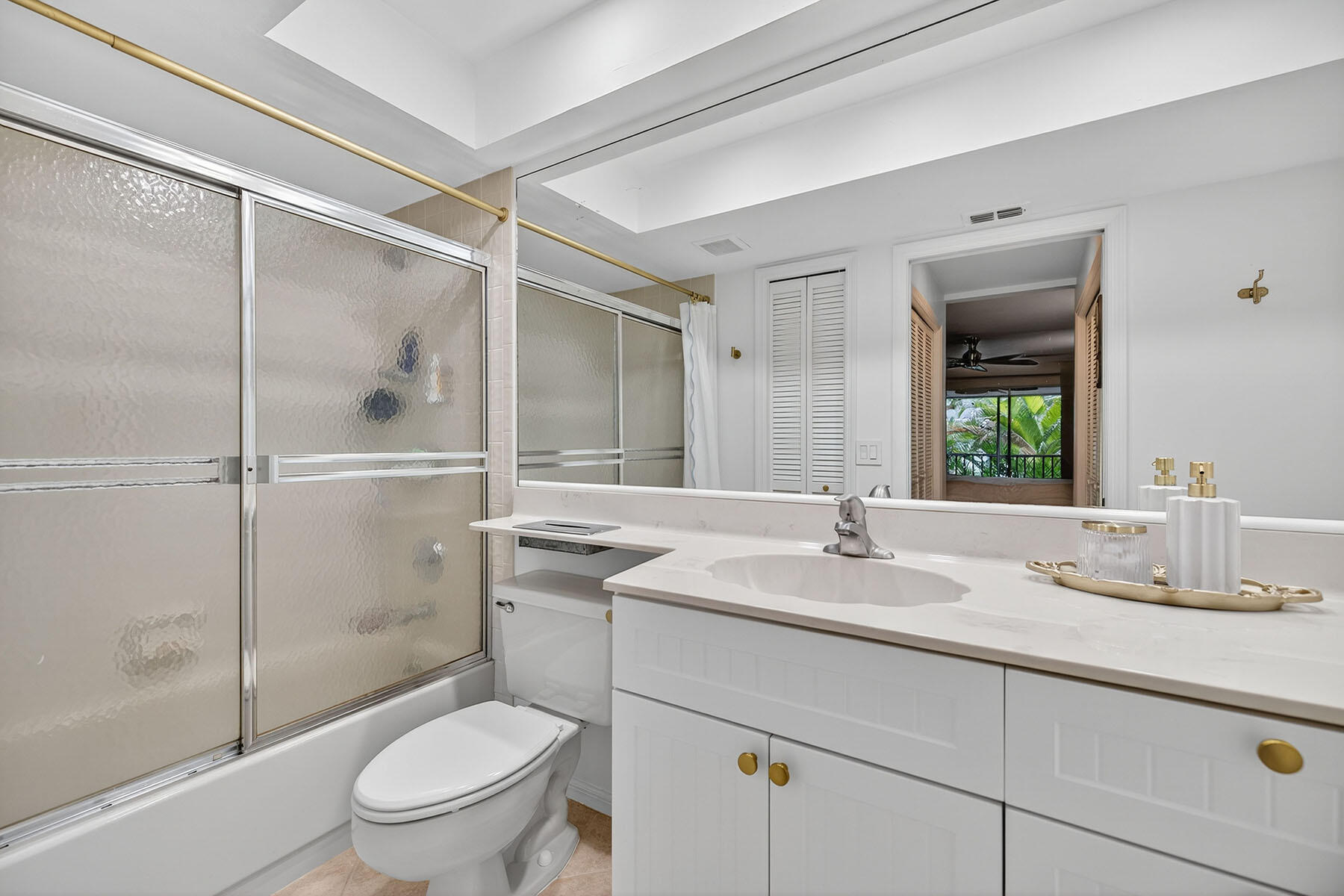 3136 Kings Lake Boulevard, Unit 7546 Naples, FL 34112 - Photo 16 of 32 a bathroom with a sink toilet and shower