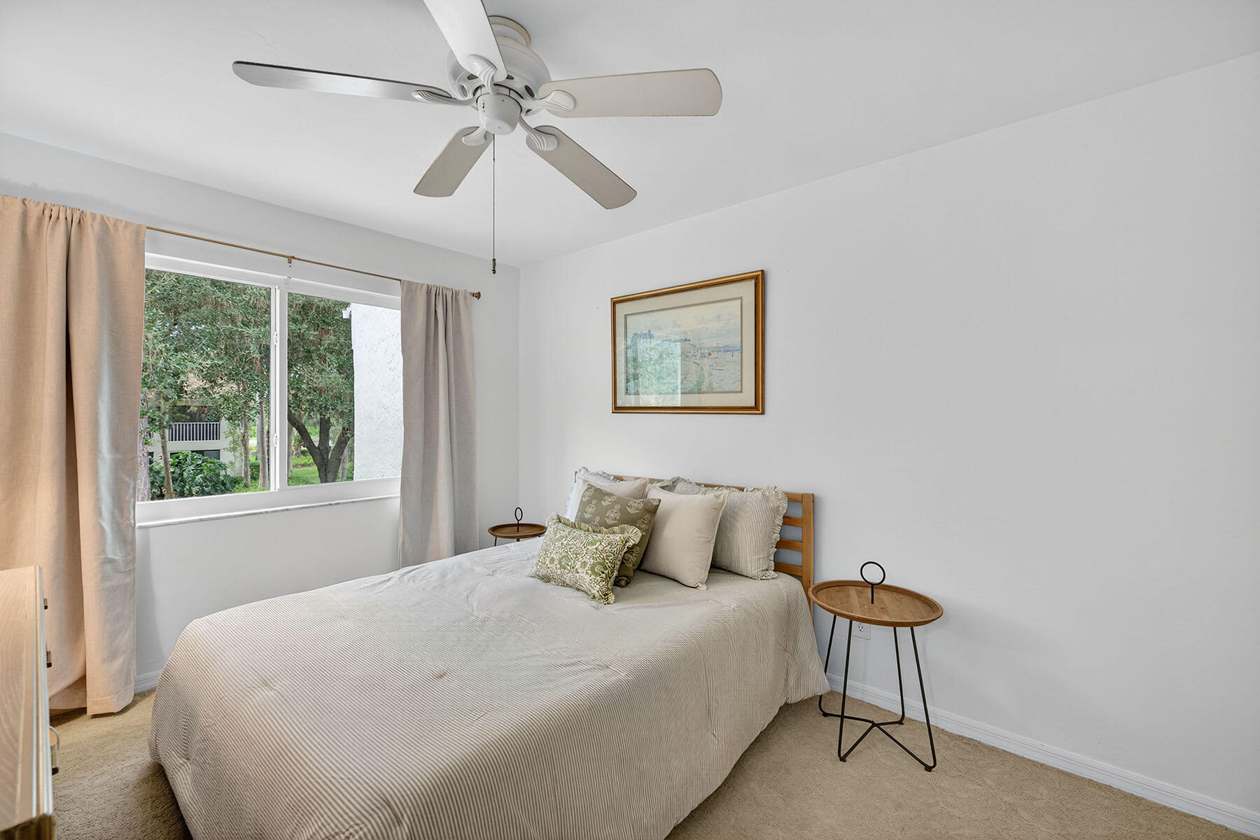 3136 Kings Lake Boulevard, Unit 7546 Naples, FL 34112 - Photo 18 of 32 a bedroom with a bed and a window