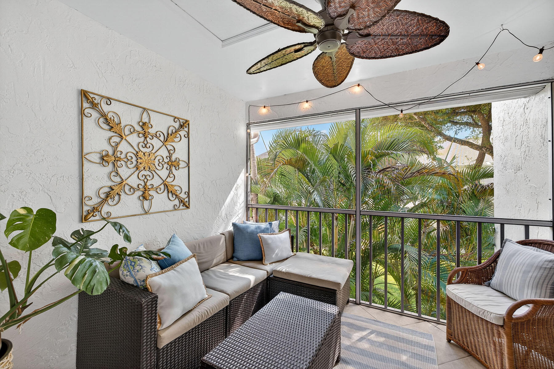 3136 Kings Lake Boulevard, Unit 7546 Naples, FL 34112 - Photo 22 of 32 a living room with furniture and a large window