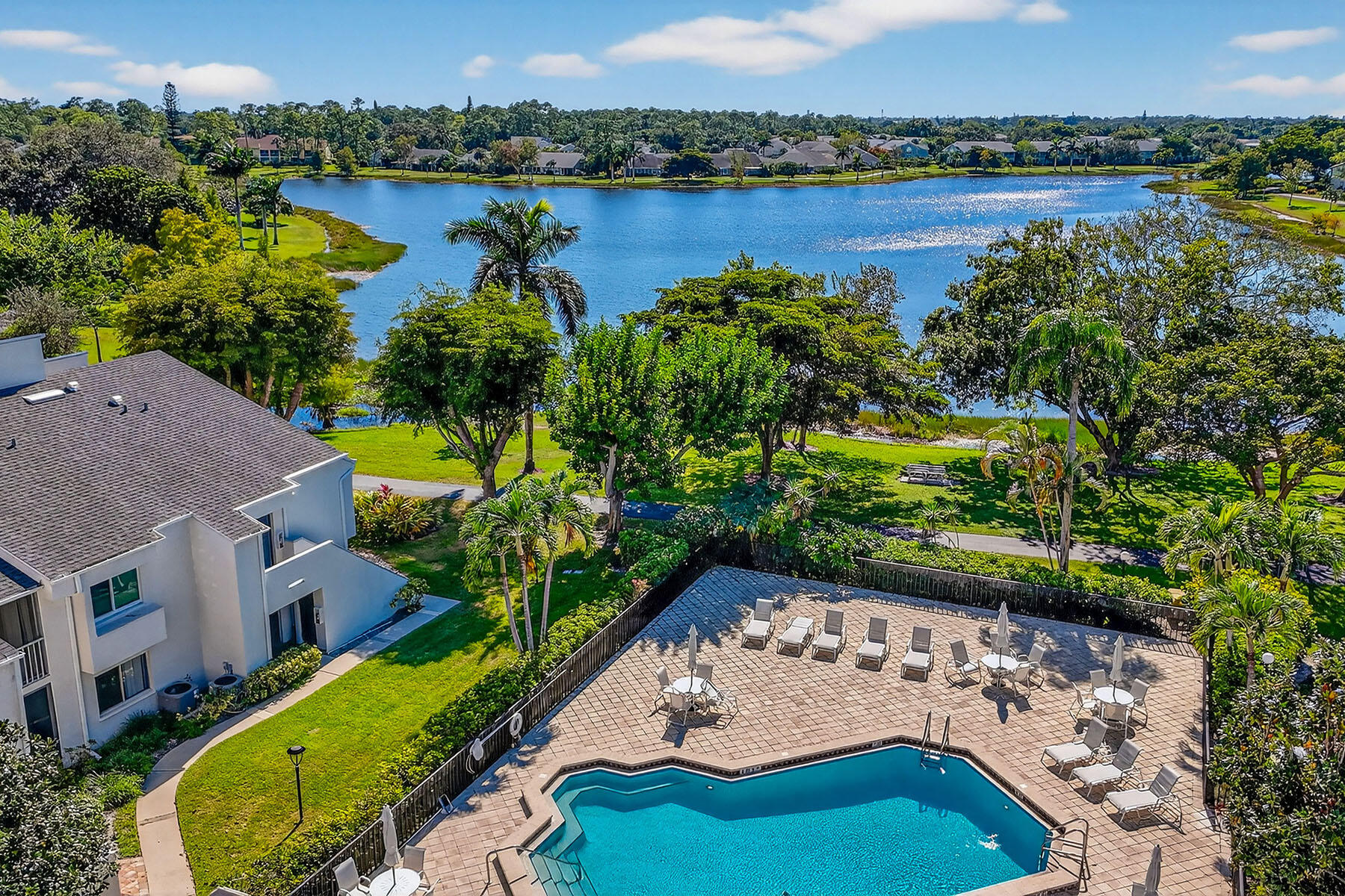 3136 Kings Lake Boulevard, Unit 7546 Naples, FL 34112 - Photo 29 of 32 an aerial view of ocean with residential house