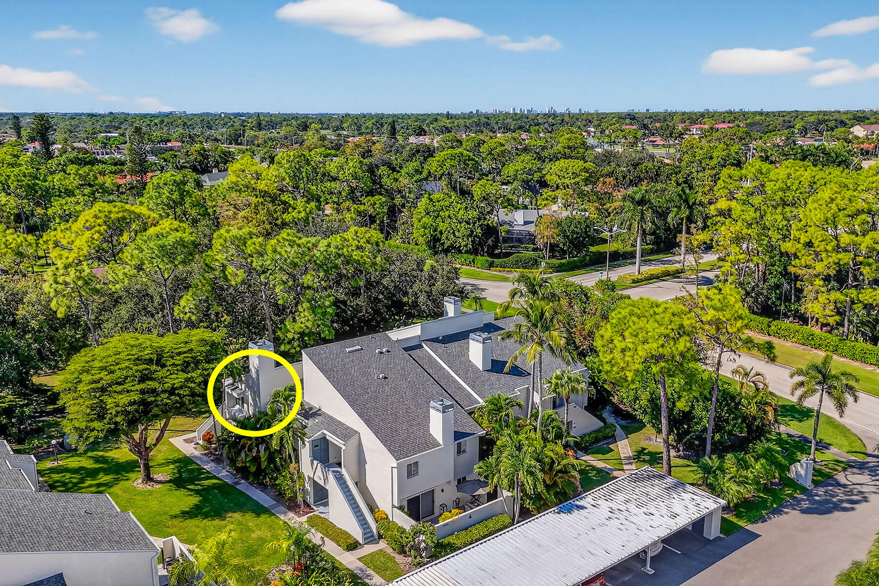 3136 Kings Lake Boulevard, Unit 7546 Naples, FL 34112 - Photo 32 of 32 an aerial view of a house with a garden