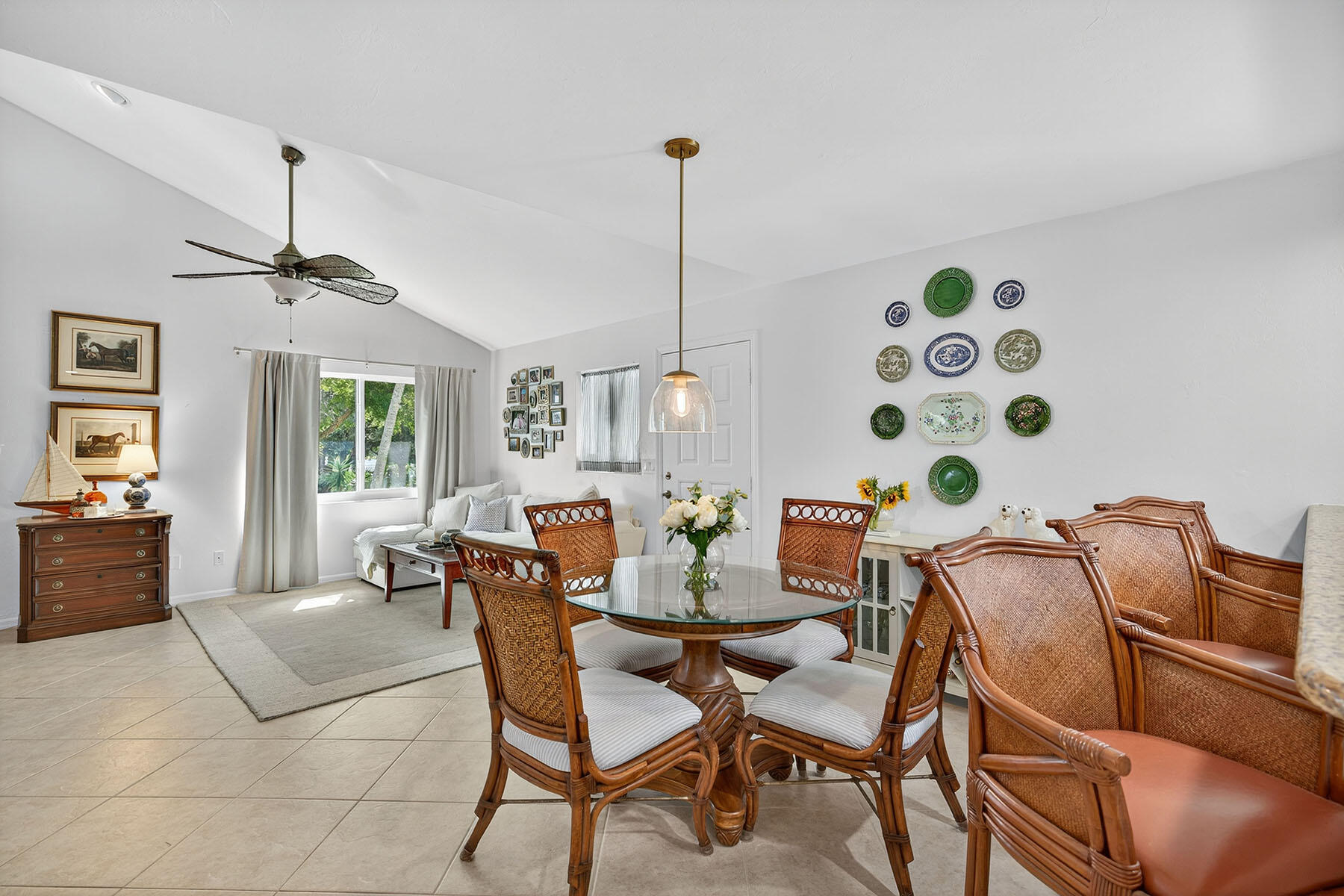3136 Kings Lake Boulevard, Unit 7546 Naples, FL 34112 - Photo 9 of 32 a dining room with furniture and window