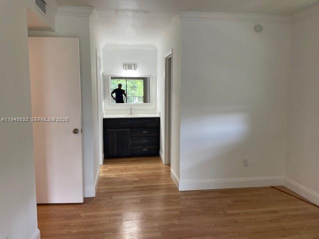 15325 Southwest 106th Terrace, Unit 618 Miami, FL 33196 - Photo 15 of 27 a view of a hallway and a room with wooden floor