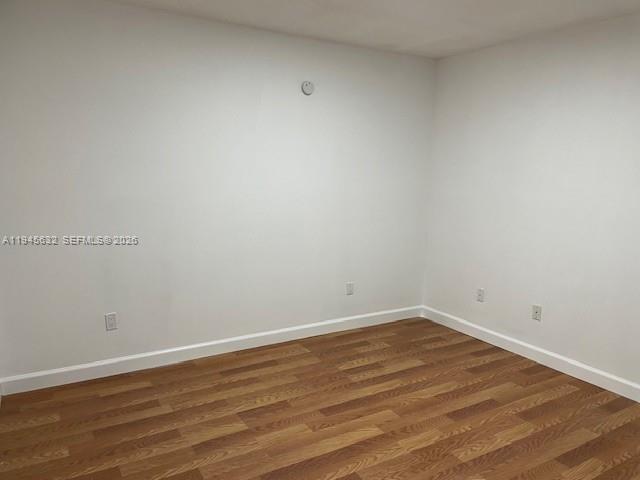 15325 Southwest 106th Terrace, Unit 618 Miami, FL 33196 - Photo 17 of 27 a view of an empty room with wooden floor