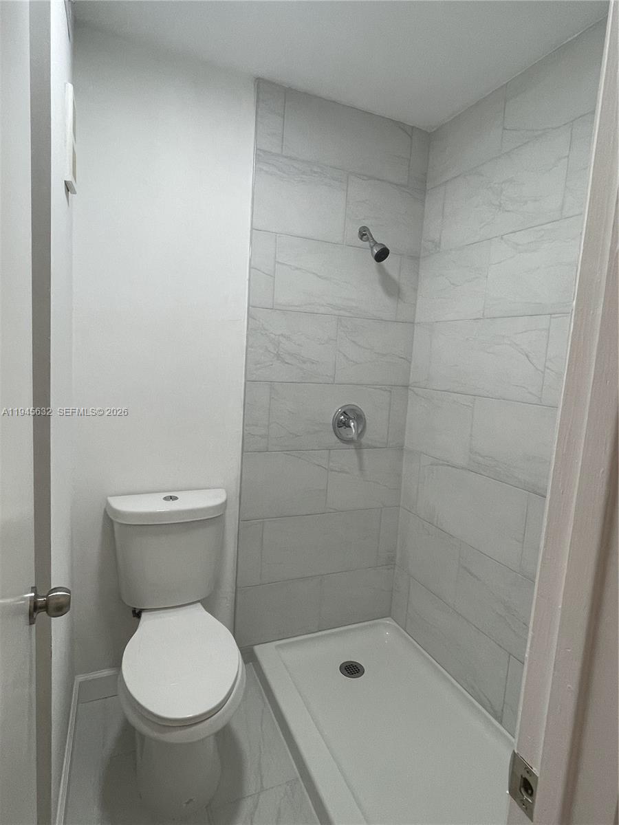 15325 Southwest 106th Terrace, Unit 618 Miami, FL 33196 - Photo 22 of 27 a bathroom with a toilet and a shower