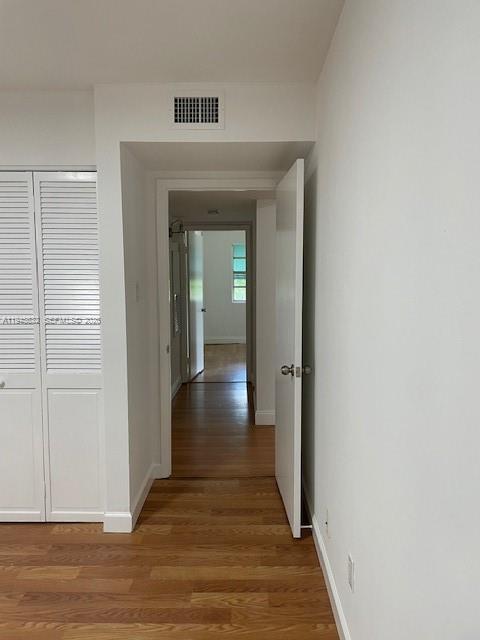 15325 Southwest 106th Terrace, Unit 618 Miami, FL 33196 - Photo 23 of 27 a view of a hallway with wooden floor