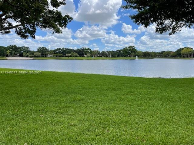 15325 Southwest 106th Terrace, Unit 618 Miami, FL 33196 - Photo 26 of 27 a view of a lake with houses in the back