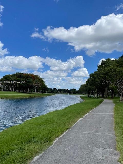 15325 Southwest 106th Terrace, Unit 618 Miami, FL 33196 - Photo 27 of 27 a view of a lake in front of house with a yard