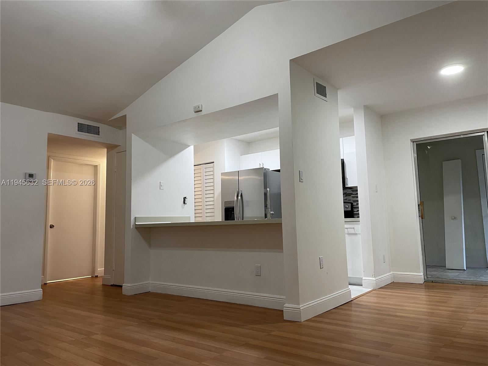 15325 Southwest 106th Terrace, Unit 618 Miami, FL 33196 - Photo 5 of 27 a view of a kitchen with wooden floor