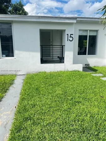 a front view of a house with a garage