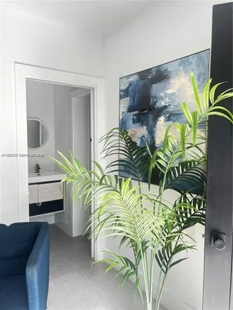 a bedroom with a bed and ceiling fan