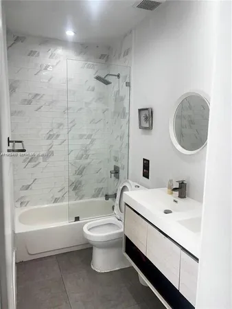 a bathroom with a sink a toilet and a bathtub