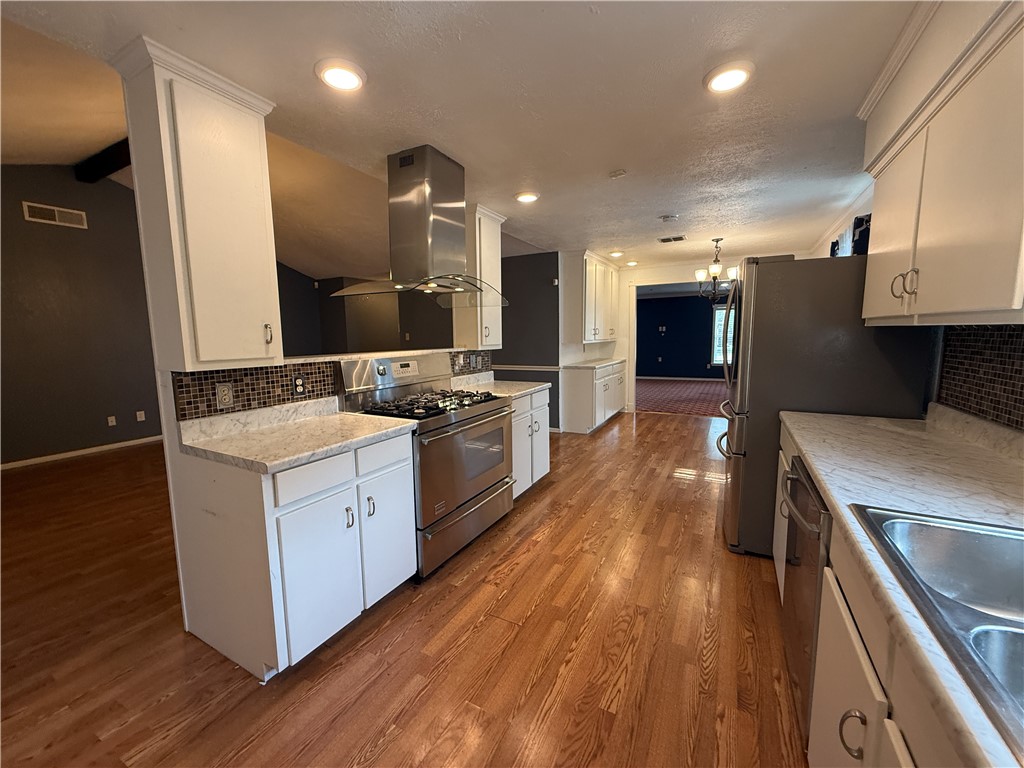 10502 Hemlock Road Corpus Christi, TX 78410 - Photo 11 of 31 a kitchen with a sink appliances and cabinets